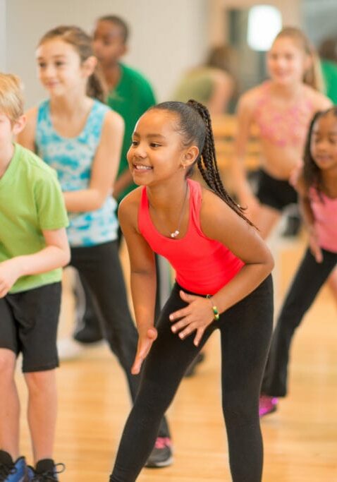 Diverse group of children in a dance fitness class